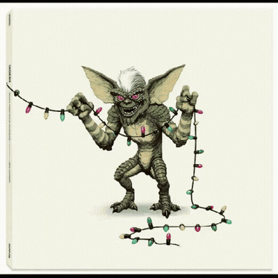 A Picture Of A Gremlin Holding A String Of Lights GIF