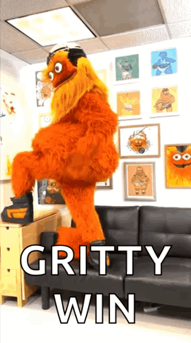 A Picture Of A Gritty Win Mascot Dancing GIF