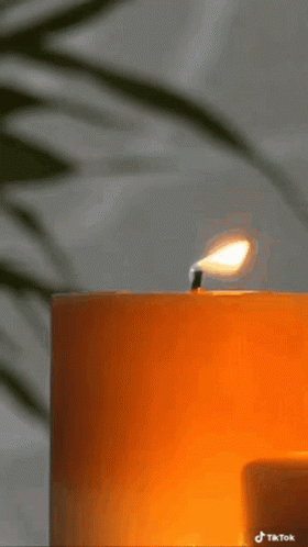 A Picture Of A Lit Candle With The Words My B On It GIF