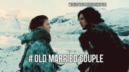 A Picture Of A Man And A Woman Standing In The Snow With The Caption # Old Married Couple GIF