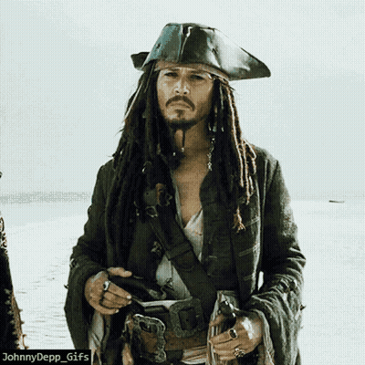 A Picture Of A Man Dressed As A Pirate With Dreadlocks GIF
