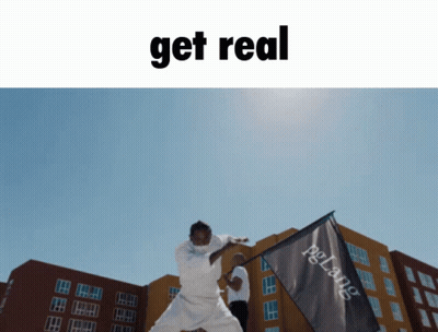 A Picture Of A Man Holding A Flag With The Words Get Real Below It GIF