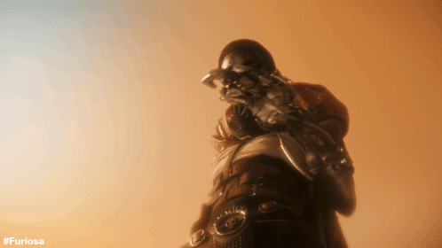 A Picture Of A Man Holding A Gun With The Hashtag #Furiosa On The Bottom GIF