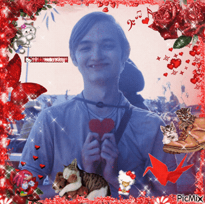 A Picture Of A Man Holding A Heart Is Surrounded By Red Flowers GIF