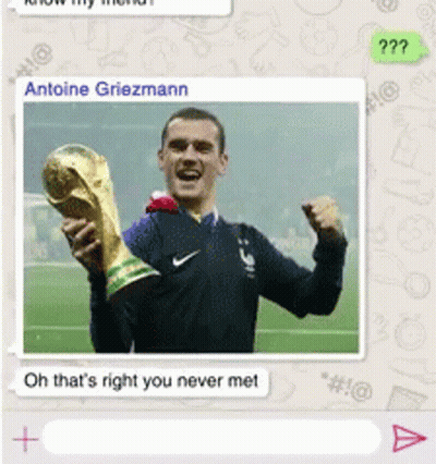 A Picture Of A Man Holding A Trophy With The Name Antoine Griezmann At The Top GIF