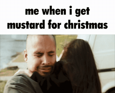 A Picture Of A Man Hugging A Woman With The Caption Me When I Get Mustard For Christmas GIF