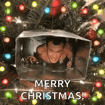 A Picture Of A Man In A Box With The Words Merry Christmas GIF