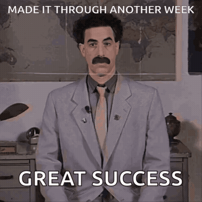 A Picture Of A Man In A Suit And Tie Says Great Success GIF