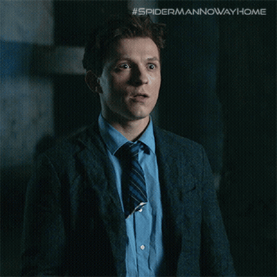 A Picture Of A Man In A Suit And Tie With The Caption " The Multiverse Is Real " GIF