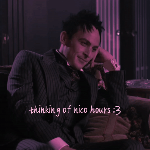 A Picture Of A Man In A Suit With The Words Thinking Of Nico Hours Written Below Him GIF