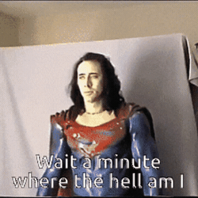 A Picture Of A Man In A Superman Costume With The Words Wait A Minute Where The Hell Am I GIF