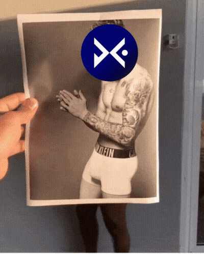 A Picture Of A Man In Calvin Klein Underwear Is Being Held Up By Someone GIF