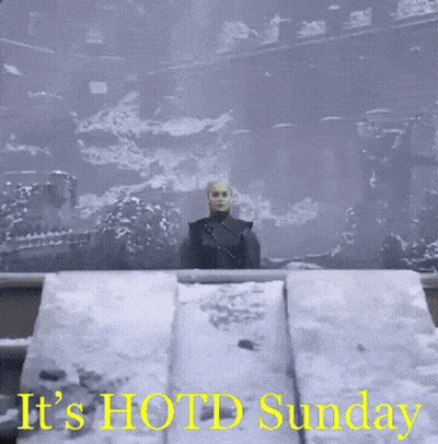 A Picture Of A Man In The Snow With The Words " It 'S Hot Sunday " GIF