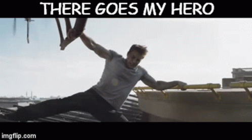 A Picture Of A Man On A Roof With The Words There Goes My Hero Above Him GIF