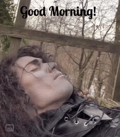 A Picture Of A Man Sleeping With The Words Good Morning GIF