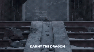 A Picture Of A Man Standing In Front Of A Wall With The Words Dadanny The Dragon On The Bottom GIF
