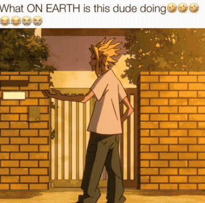 A Picture Of A Man Standing Next To A Brick Wall With The Caption What On Earth Is This Dude Doing GIF