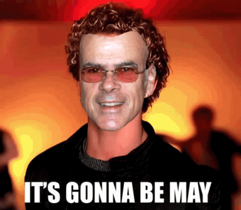 A Picture Of A Man With Curly Hair And The Words It 'S Gonna Be May On The Bottom GIF