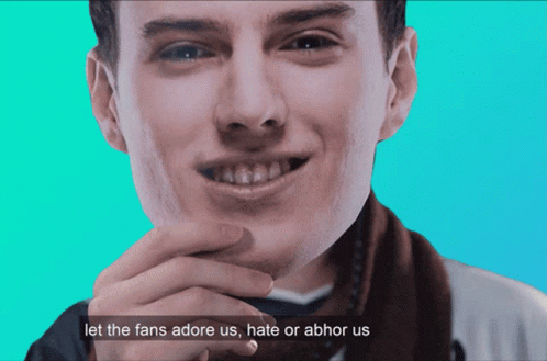 A Picture Of A Man With The Words " Let The Fans Adore Us Hate Or Abhor Us " Below Him GIF