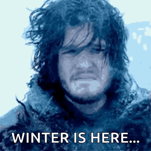 A Picture Of A Man With The Words Winter Is Here Below Him GIF