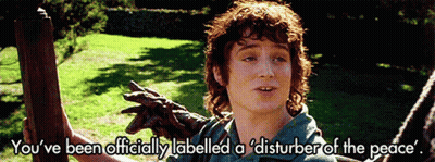 A Picture Of A Man With The Words " You 'Ve Been Officially Labelled A Disturber Of The Peace " Above Him GIF