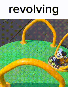 A Picture Of A Merry Go Round With The Word Revolving On The Bottom GIF
