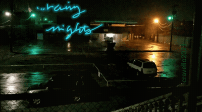 A Picture Of A Parking Lot At Night With The Words Raining Nights Written On It GIF