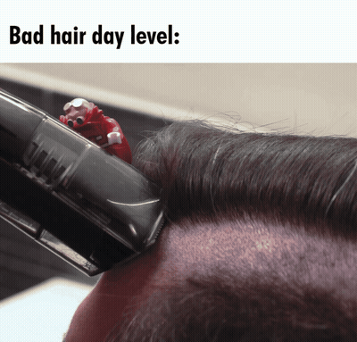 A Picture Of A Person Getting Their Hair Cut With A Caption That Says " Bad Hair Day Level " GIF