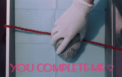 A Picture Of A Person Holding A Heart And The Words You Complete Me GIF