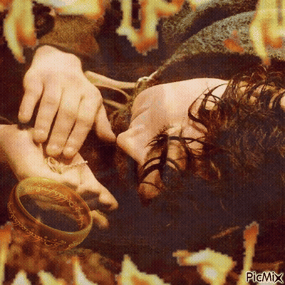 A Picture Of A Person Laying Down With A Ring On Their Hand With Picmix Written On The Bottom GIF