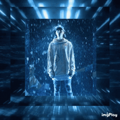 A Picture Of A Person Standing In The Rain With The Words Imgplay Written Below It GIF