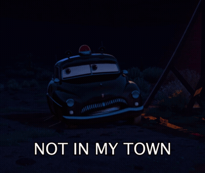 A Picture Of A Police Car With The Words " Not In My Town " Below It GIF