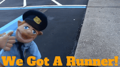 A Picture Of A Police Officer With The Words We Got A Runner Below Him GIF