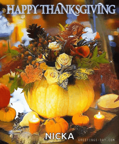 A Picture Of A Pumpkin Filled With Flowers And Candles Says Happy Thanksgiving GIF