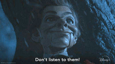 A Picture Of A Puppet With The Words " Do N't Listen To Them " Below It GIF