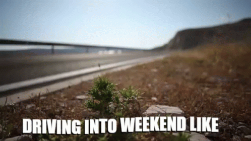 A Picture Of A Road With The Words `` Driving Into Weekend Like '' Written In The Foreground . GIF