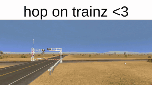A Picture Of A Santa Fe Train Crossing A Road GIF