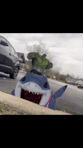 A Picture Of A Shark With A Hulk On It 'S Head GIF