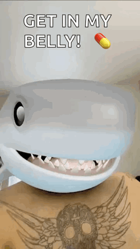 A Picture Of A Shark With The Words Get In My Belly Above It GIF