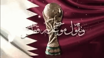 A Picture Of A Soccer Trophy With Arabic Writing Behind It GIF
