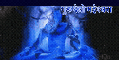 A Picture Of A Statue Of Shiva In A Dark Room With A Blue Light Coming Out Of It GIF