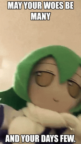 A Picture Of A Stuffed Animal With Green Hair And The Words " May Your Woes Be Many And Your Days Few " GIF