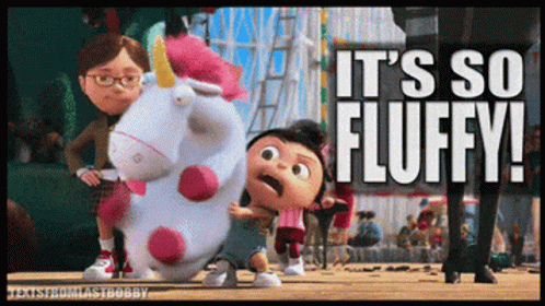 A Picture Of A Stuffed Unicorn With The Words It 'S So Fluffy GIF