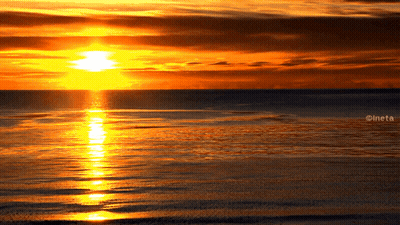 A Picture Of A Sunset Over A Body Of Water With The Watermark Ineta GIF