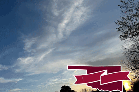 A Picture Of A Sunset With A Red And White Arrow Pointing To The Right GIF