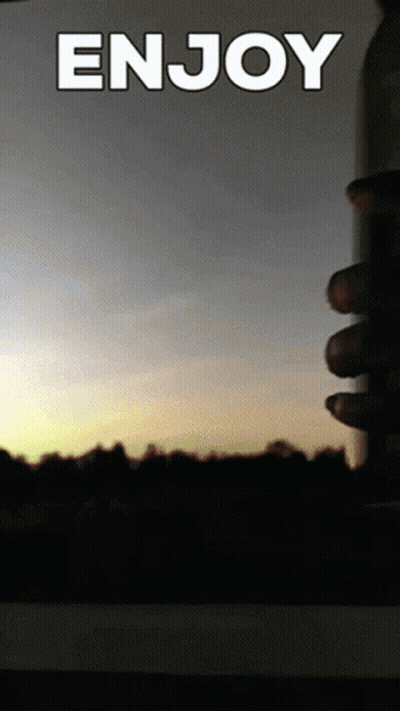 A Picture Of A Sunset With The Words Enjoy Written On It GIF