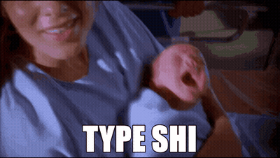 A Picture Of A Woman Holding A Baby With Type Shi Written In White GIF