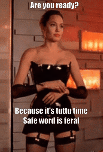 A Picture Of A Woman In A Corset With The Caption " Are You Ready Because It 'S Tutti Time Safe Word Is Feral GIF