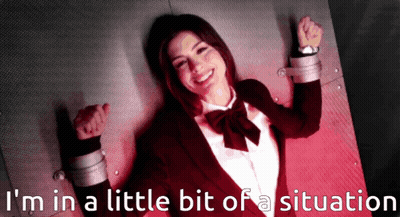 A Picture Of A Woman In A Suit And Bow Tie With The Words I 'M In A Little Bit Of A Situation Behind Her GIF