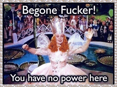 A Picture Of A Woman In A White Dress Holding A Wand With The Words Begone Fucker You Have No Power Here GIF
